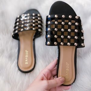 Gold studded black sandals